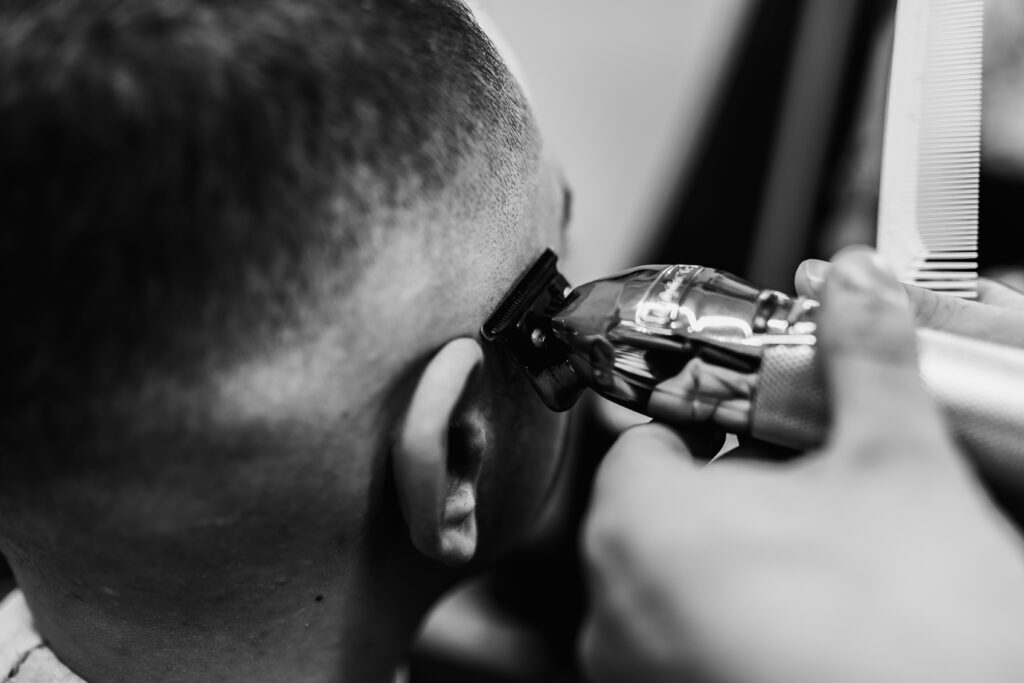 Men's haircut in a barbershop. Styling and hair care.